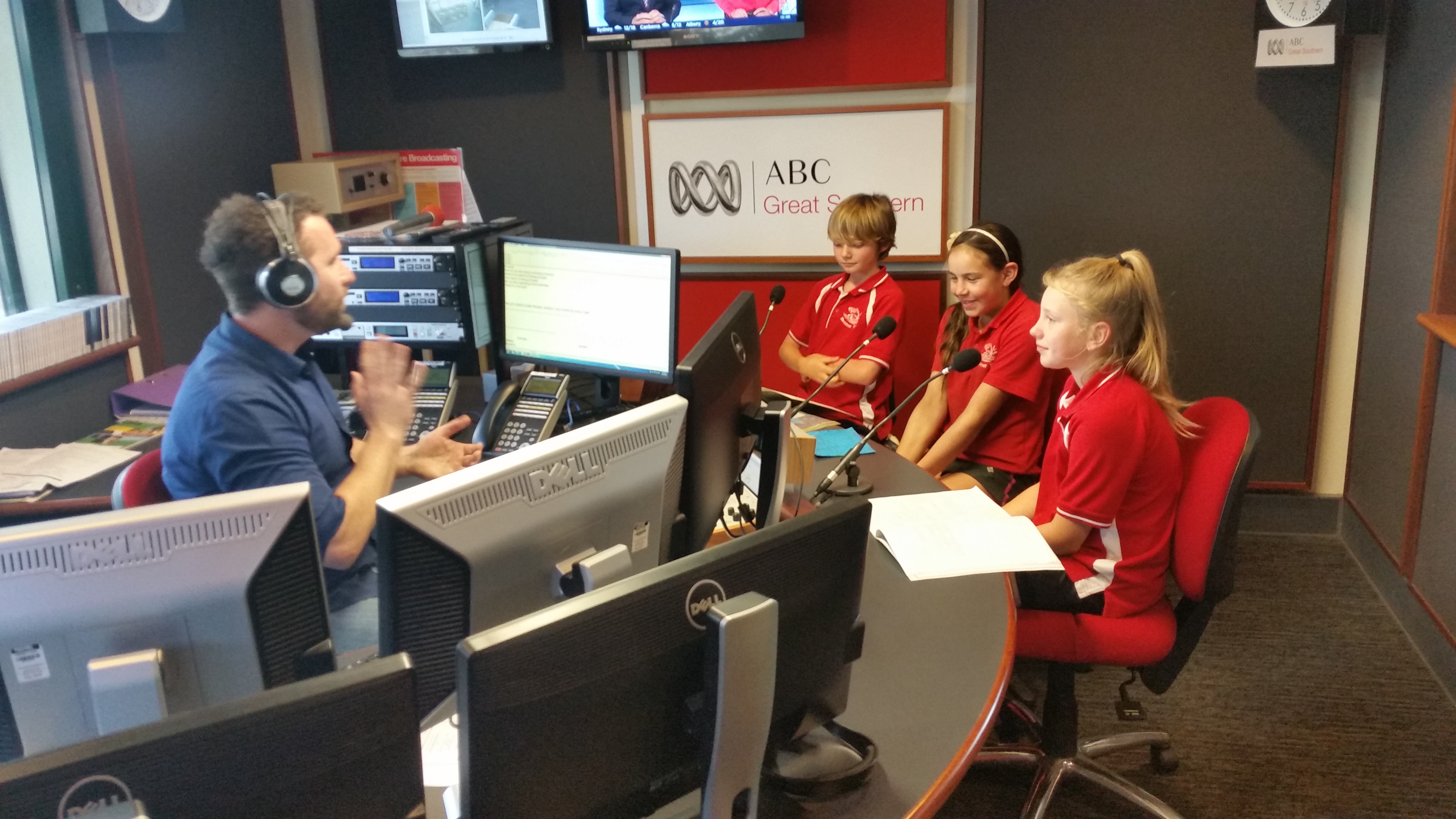 Students reading stories they have written to the Great Southern ABC radio audience.